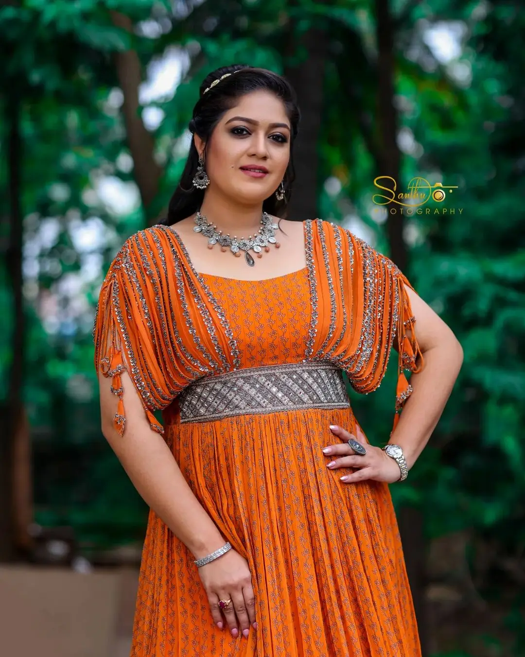 Meghana Raj Wearing Beautiful Earring Jewellery Orange Gown